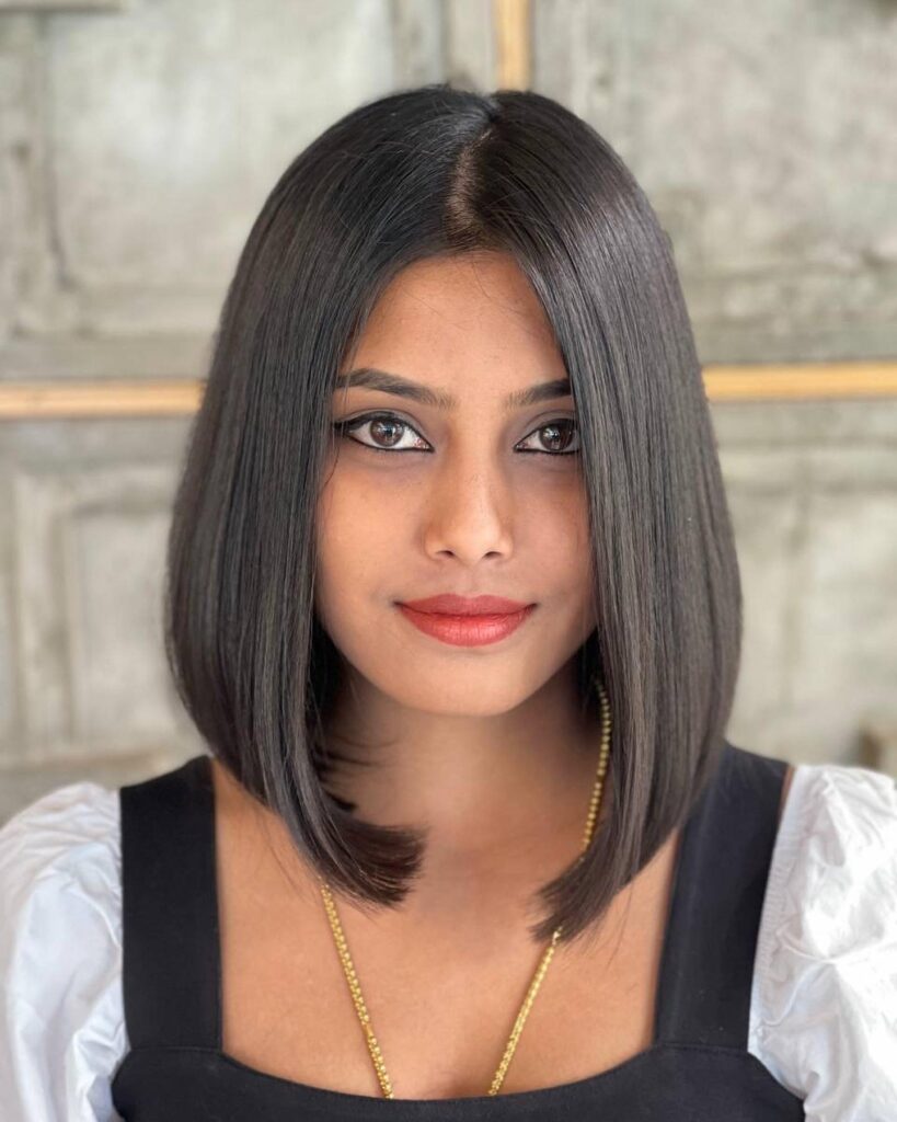 Sleek inverted long bob with a clean center part