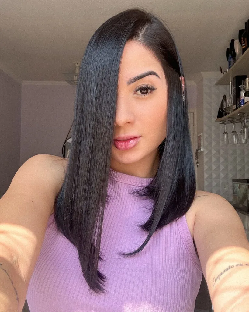 Sleek layered long bob with a deep side part