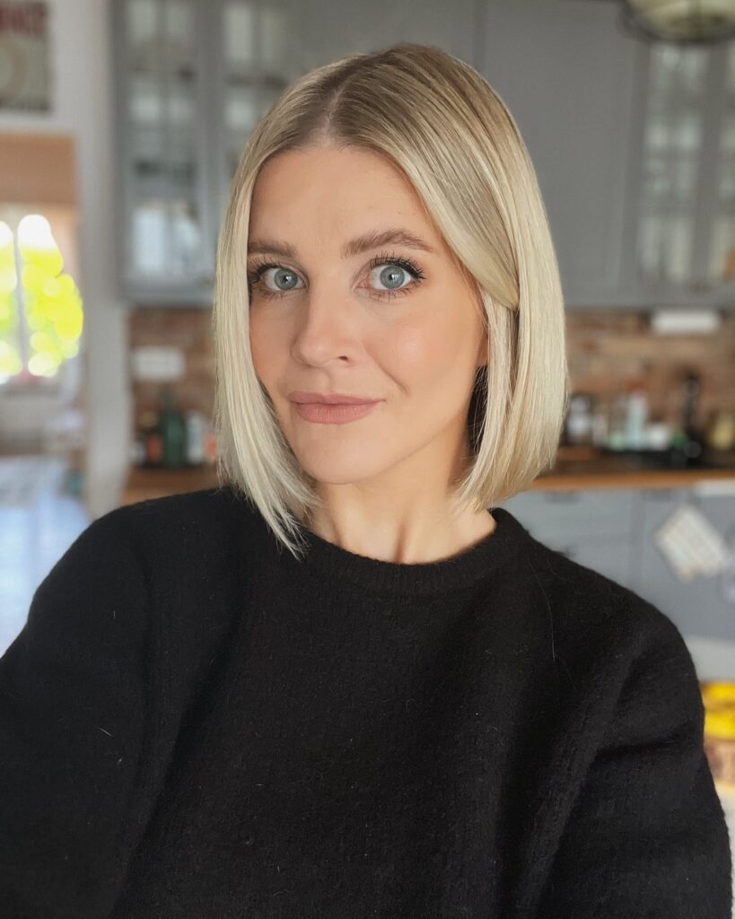 Sleek platinum blonde long bob with sharp blunt ends