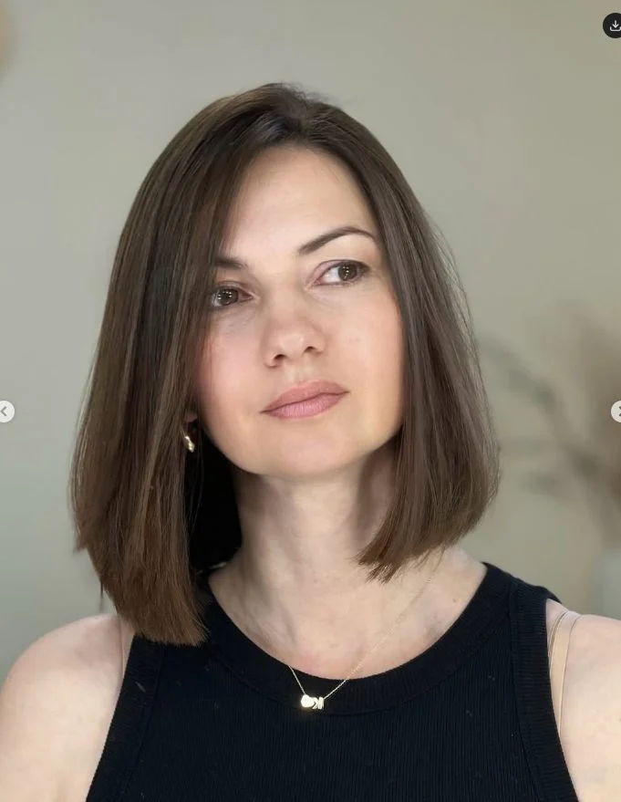 Sleek side-parted long bob with a polished finish