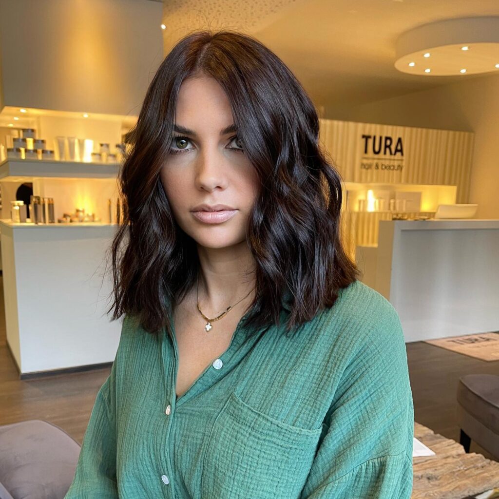 Textured long bob with deep brunette waves and middle part
