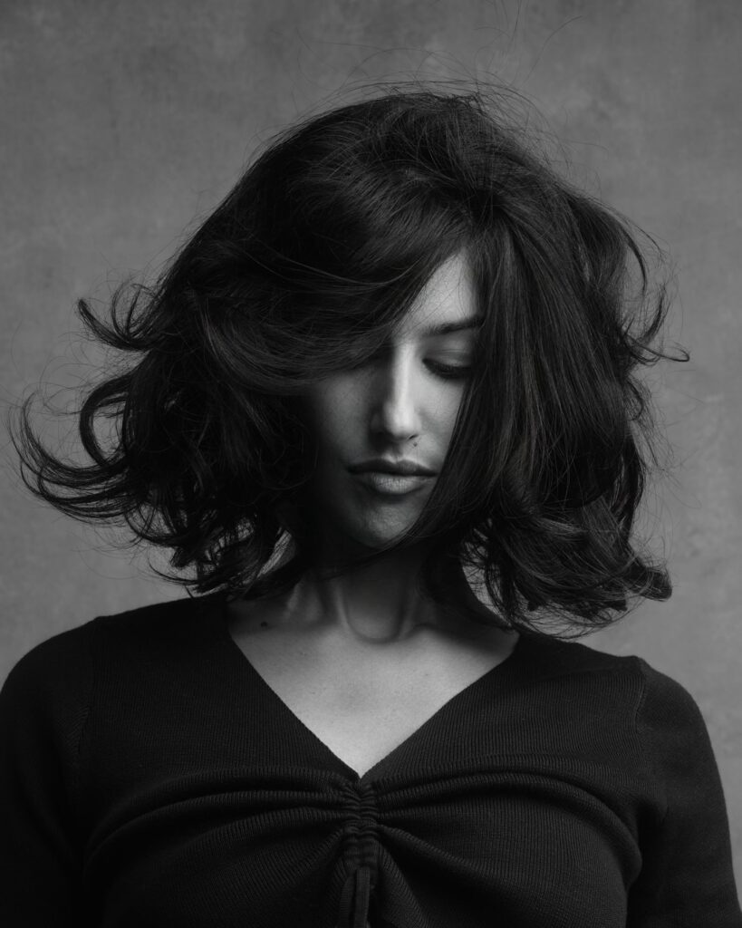 Voluminous wavy long bob with sweeping side bangs