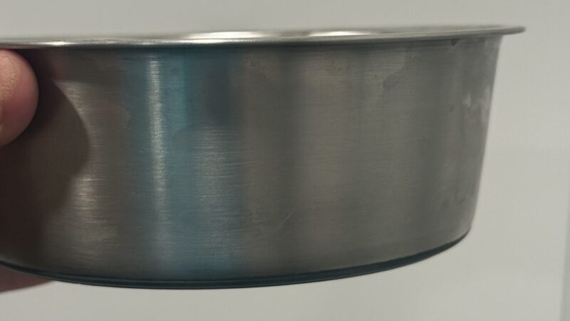 a dog bowl for cleaning