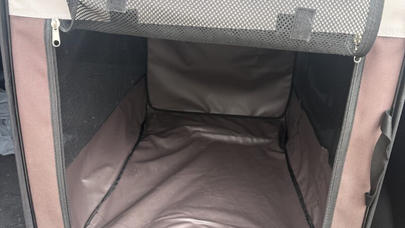 a dog kennel crate for riding in car