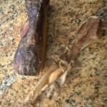 a rawhide chew in kitchen