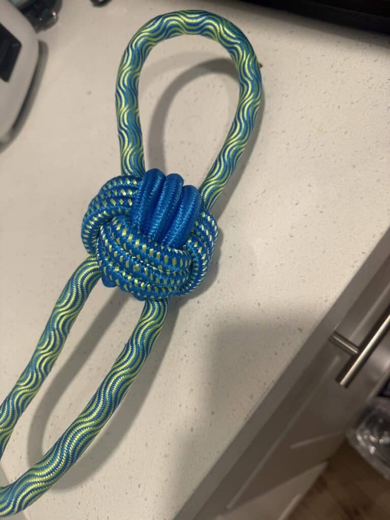a rope toy for tug of war on kitchen counter