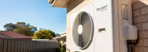 Reclaim heat pump hot water system installed on the exterior wall of a Perth home