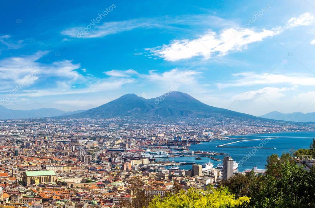 Aerial view of Naples City and waterfront on a beatifull sunny day, with Mount Vesuvius in the background. 