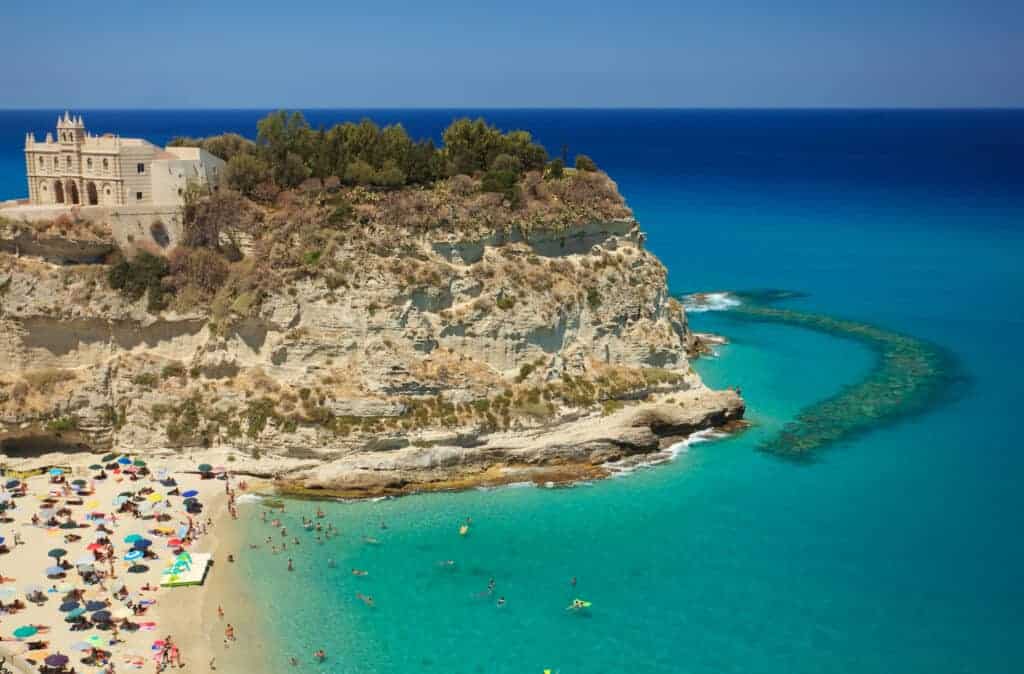 View of Tropea beach with the Historic church of Santa Maria della Isola in the background.