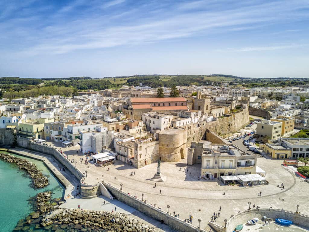 Aerial view of Otranto on a sunny day, with historic Aragonese castle in the city center, Apulia, southern Italy