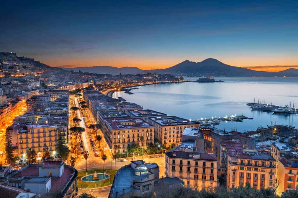 Aerial view, Naples Southern Italy, Mount Vesuvius in background at dusk.