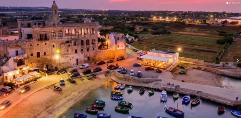 cala san vito and abbey at sunset
