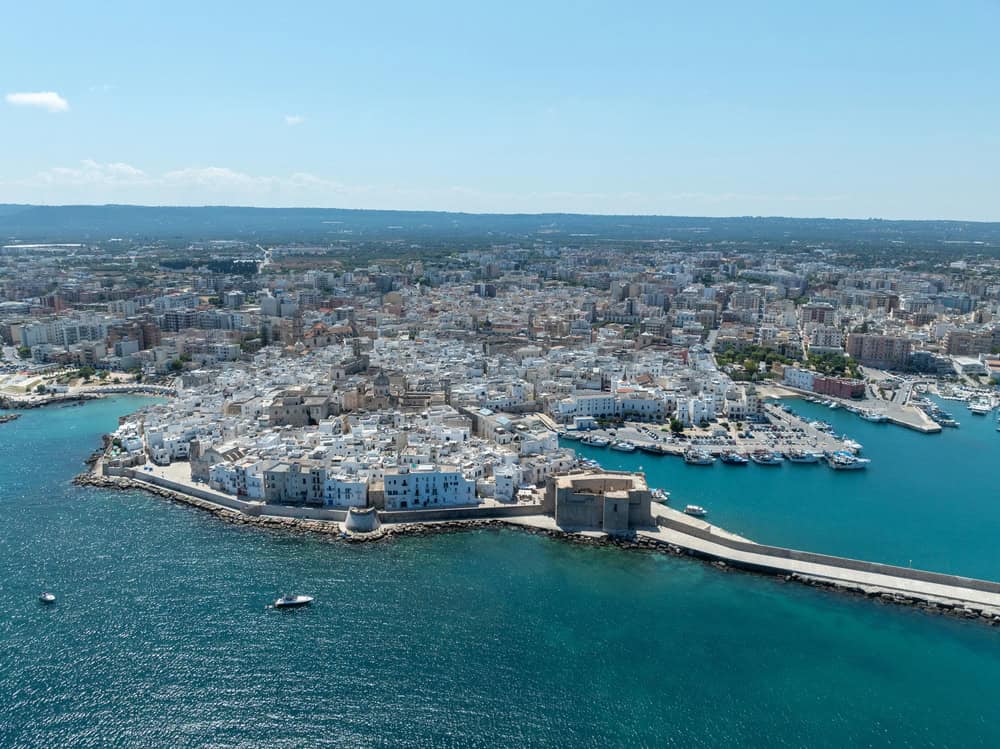 Aerial view of Monopoli in Puglia, Southern Italy, with blue sea in foreground
