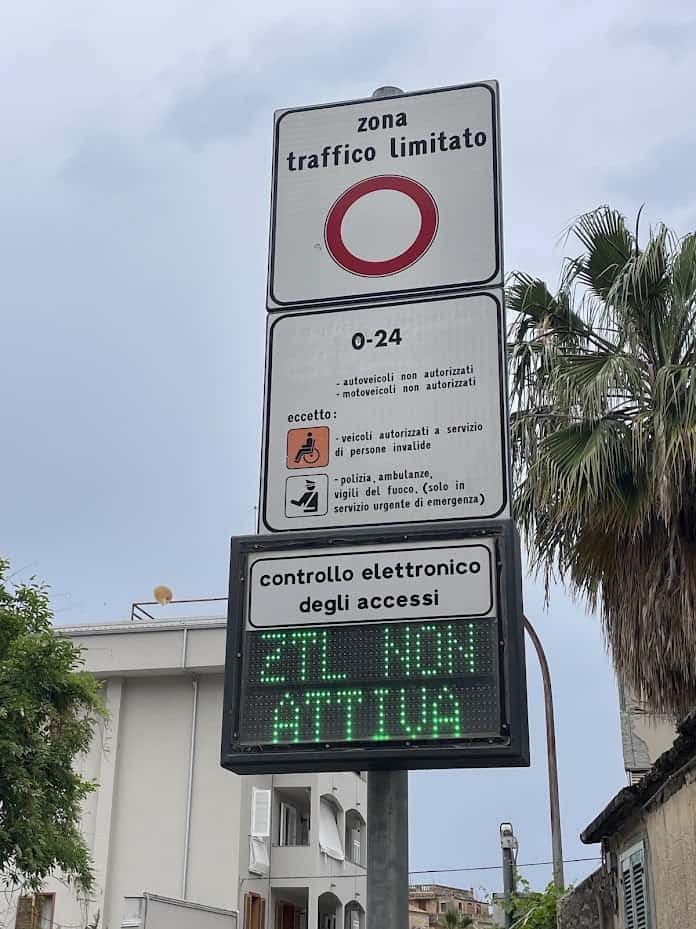 ZTL limited traffic Sign for Tropea Italy travel guide with cityscape.