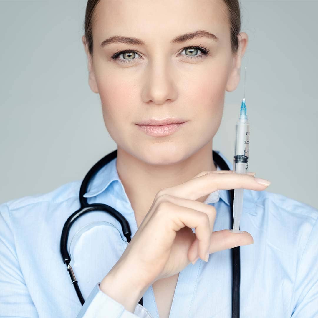 Syringe with dental anesthetic for pain-free dental treatments at Heritage Dental Centre.