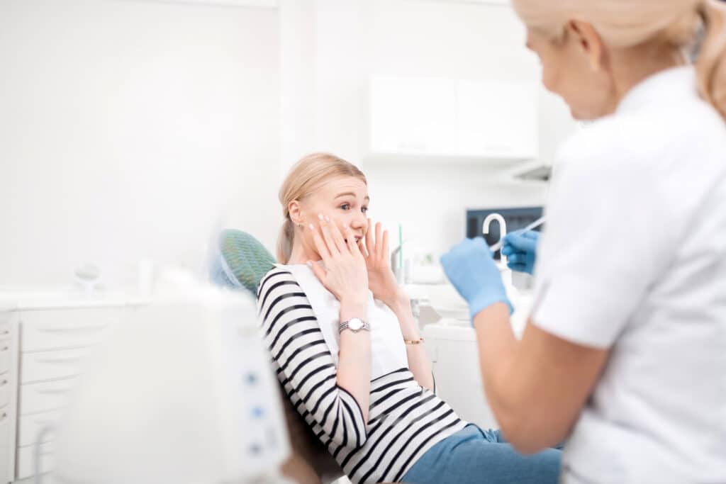 Tips for Managing Dental Anxiety 1 dentists young patient being scared of dental treatments