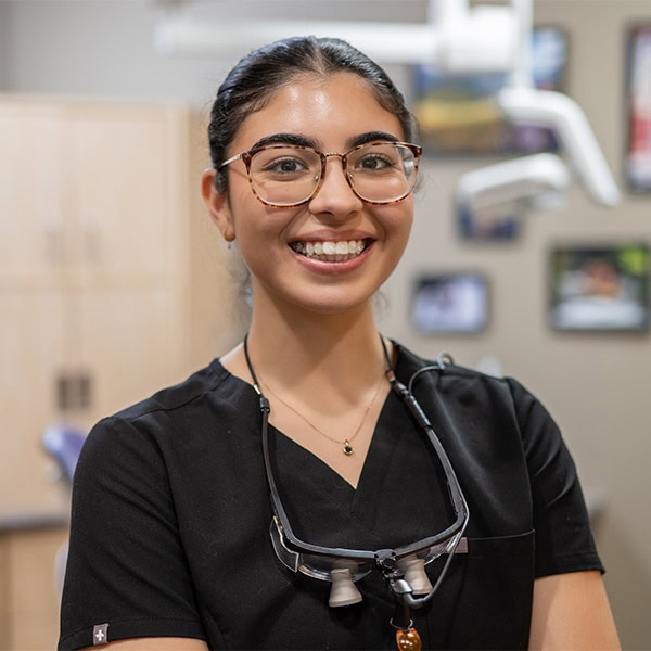 Friendly dental professional smiling at Heritage Dental Centre Edmonton.