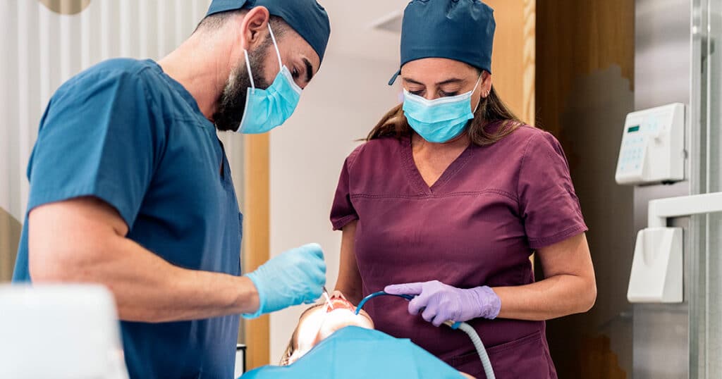 High-quality dental professionals performing oral surgery at Heritage Dental Centre Edmonton.