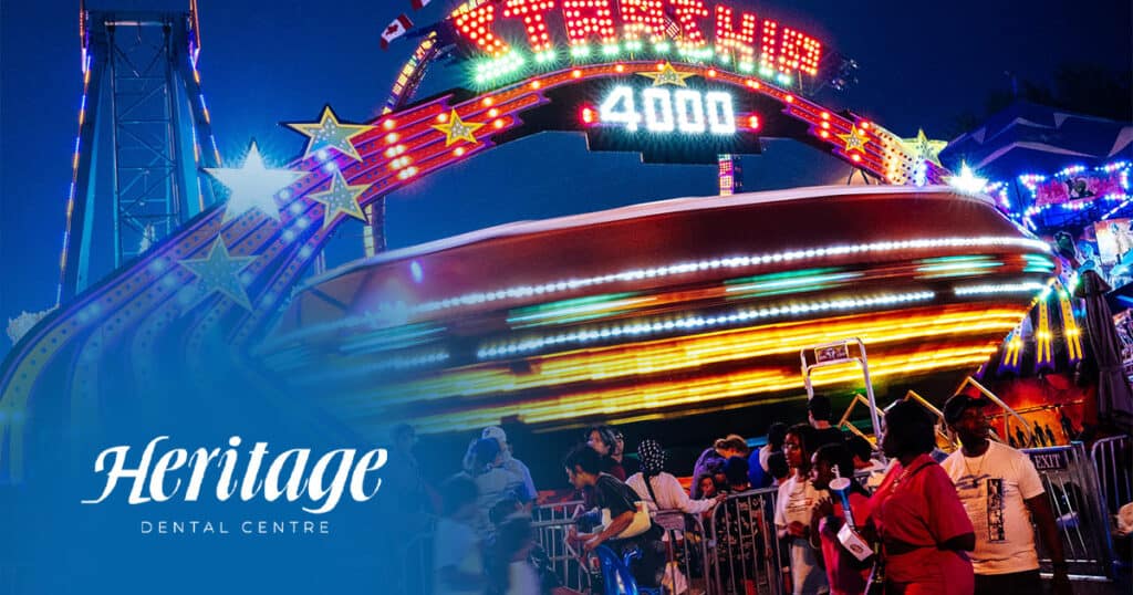 Amusement park ride at night, colorful lights, theme park entertainment, people waiting in line, family fun.