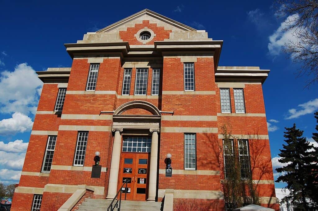 Building exterior in Edmonton with brick facade and classic architecture, offering top-quality dental services and oral health care in a modern, welcoming environment.