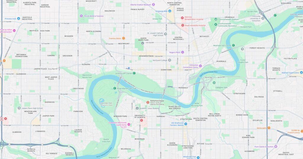Detailed map of Edmonton highlighting key neighborhoods, parks, hospitals, and landmarks. Features the North Saskatchewan River, major roads, and points of interest for residents and visitors.