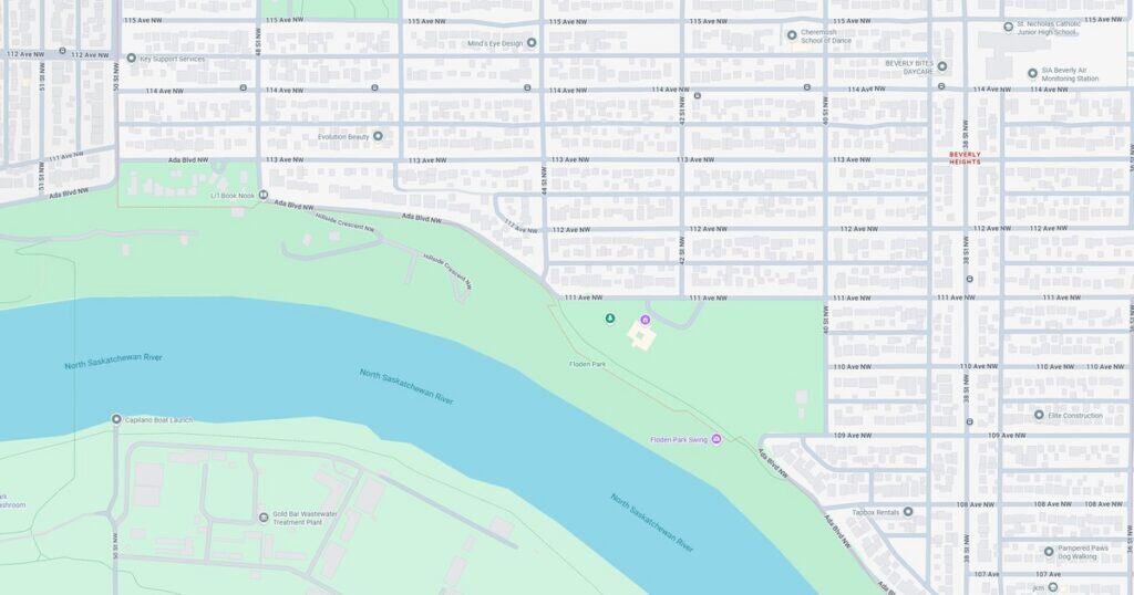 A detailed map showing Riverfront Park along with the North Sacramento River in California, highlighting green spaces, walking paths, and nearby streets.