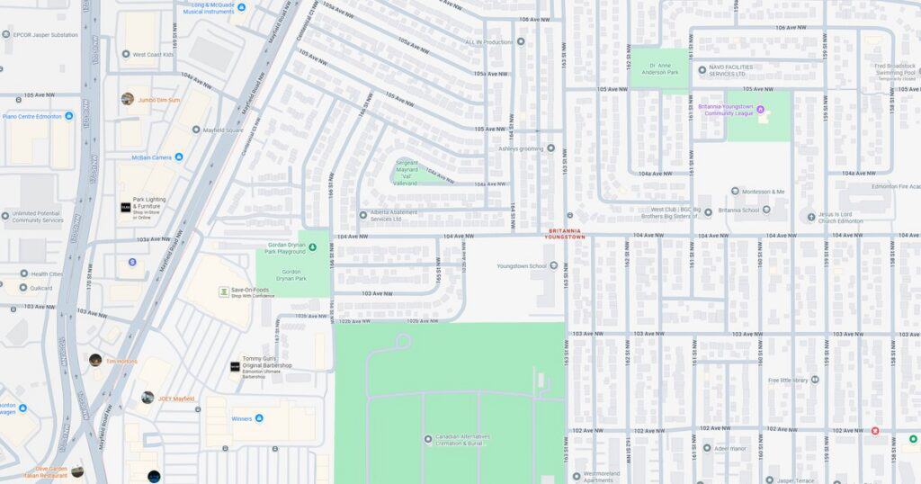 Map of city park and nearby streets, showing green spaces, roads, and landmarks in a metropolitan neighborhood.