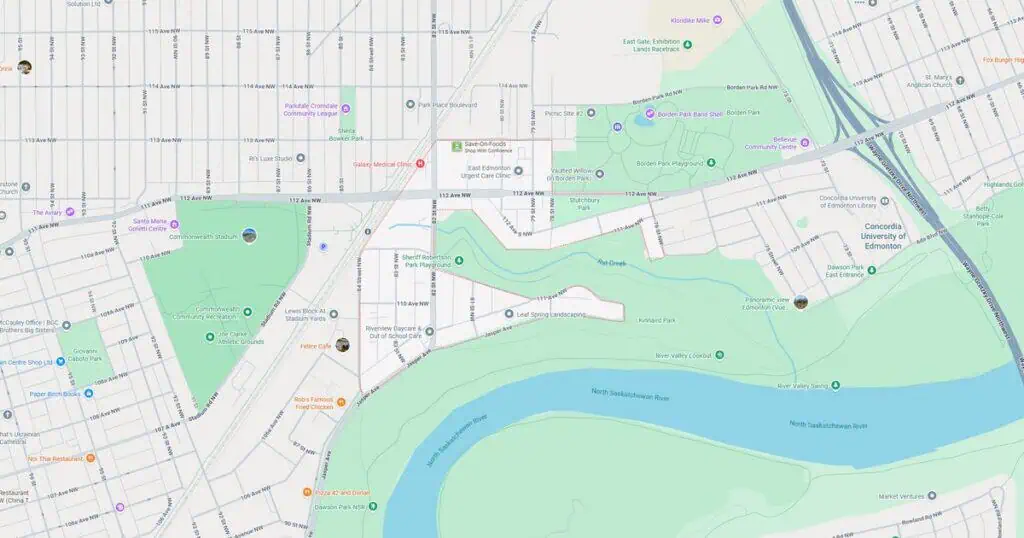 Detailed map of urban park, river, and nearby streets highlighting recreational areas and city infrastructure.
