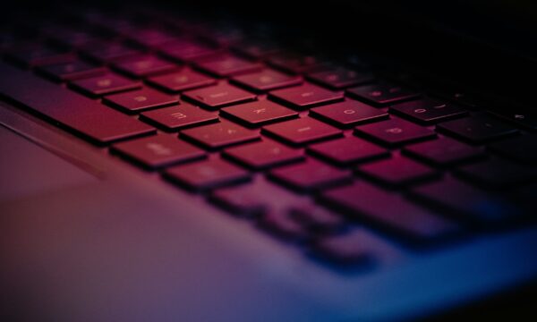 a-close-up-of-a-keyboard-with-a-blurry-background