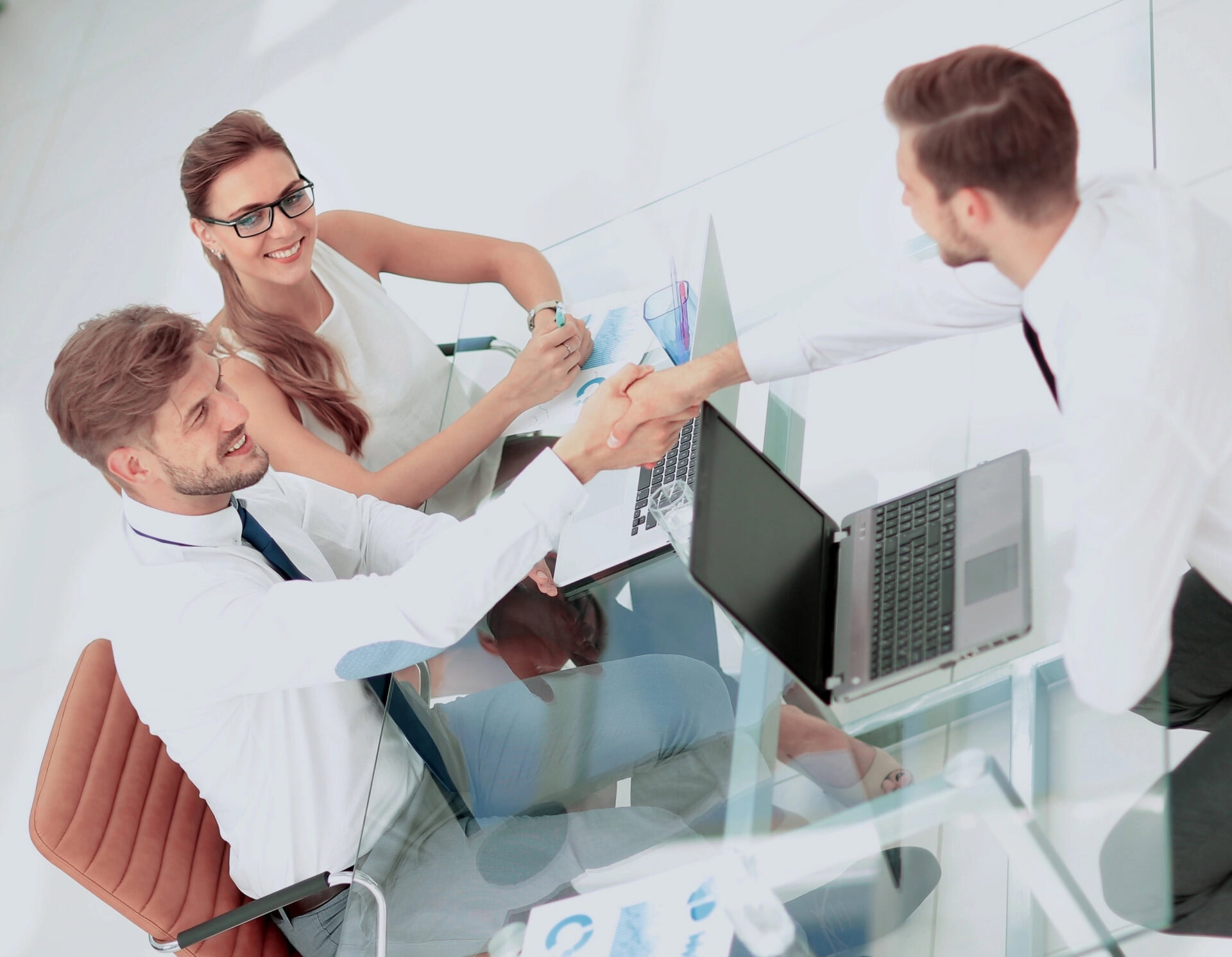 Image of business partners discussing documents and ideas at meeting