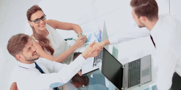 Image of business partners discussing documents and ideas at meeting