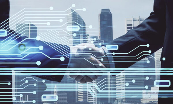 Double exposure of data theme hologram and handshake of two men.