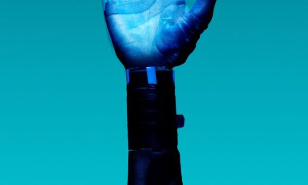 alt="Free Prosthetic Arm on Blue Background Stock Photo"