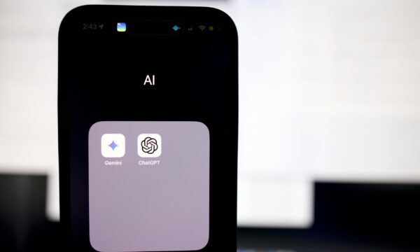 a close up of a cell phone with an ai button