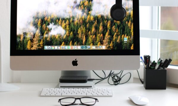 Free Turned on Silver Imac With Might Mouse and Keyboard Stock Photo