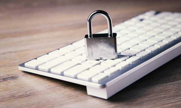 a computer keyboard with a padlock on top of it
