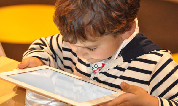 child with internet connected device