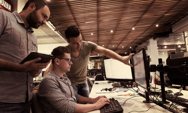 three technitians diagnosing problems