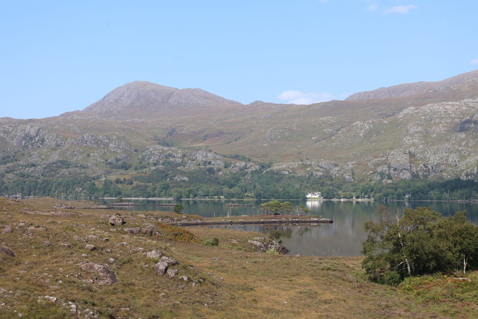 Loch Maree, Scotland on a hazy blue sky day