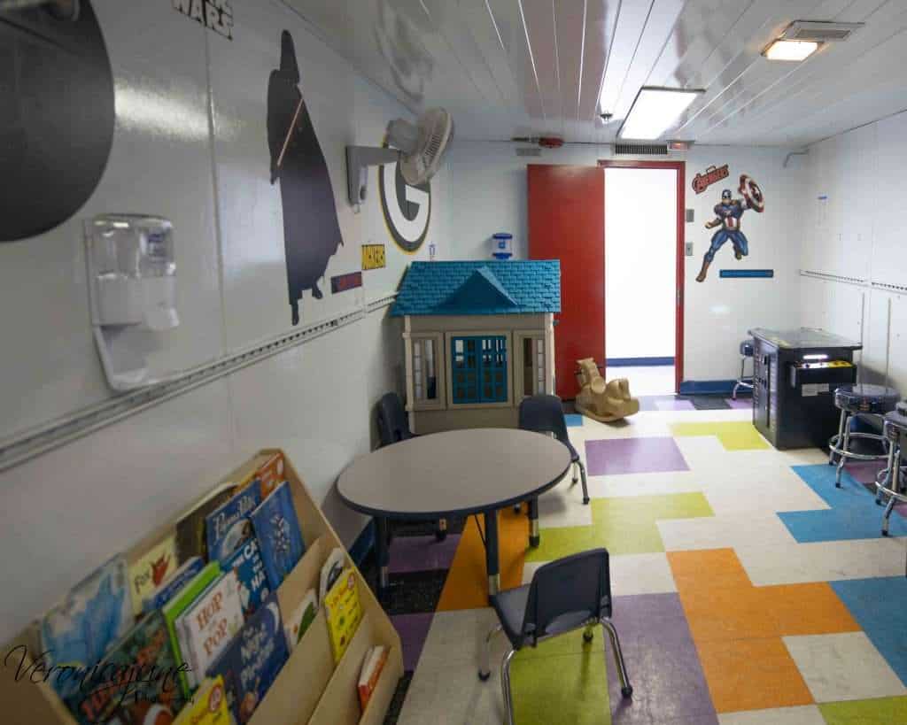 The video arcadshowing a playhouse, a book rack, and a video gamee and game room