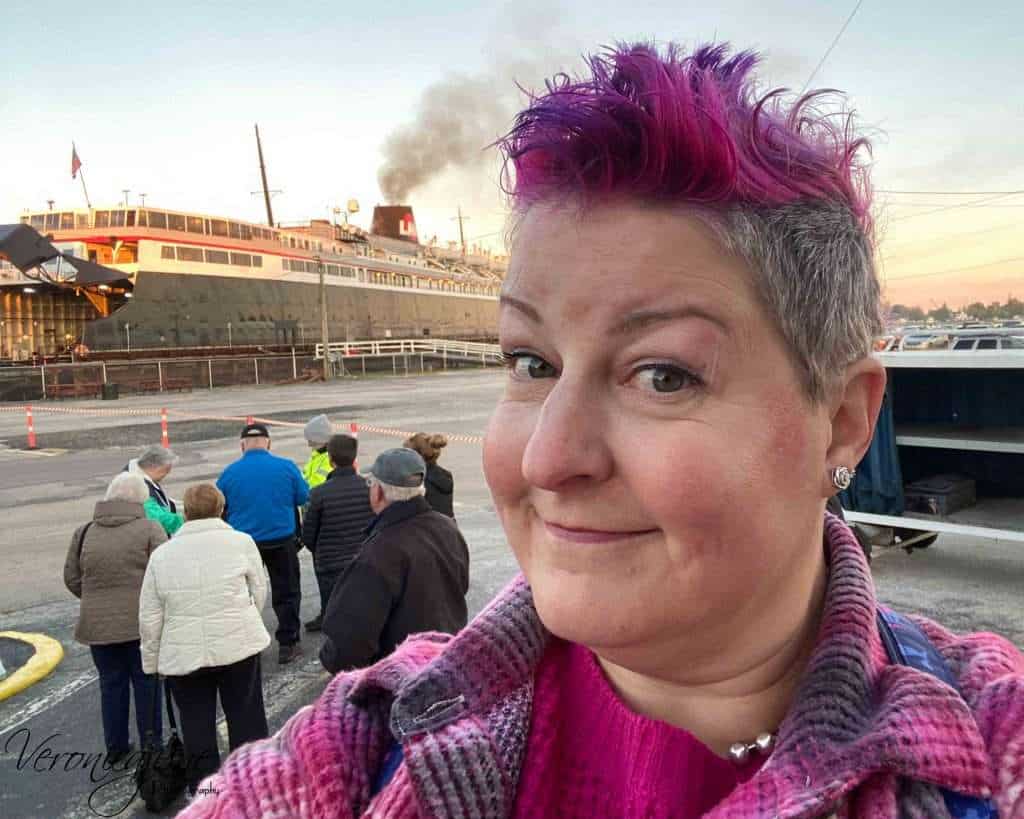 The author smiles with the SS Badger behind her