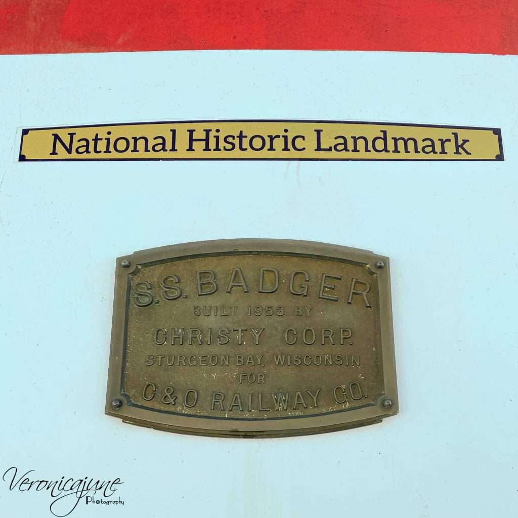 The national Historic Landmark plaque mounted on the front of the SS Badger