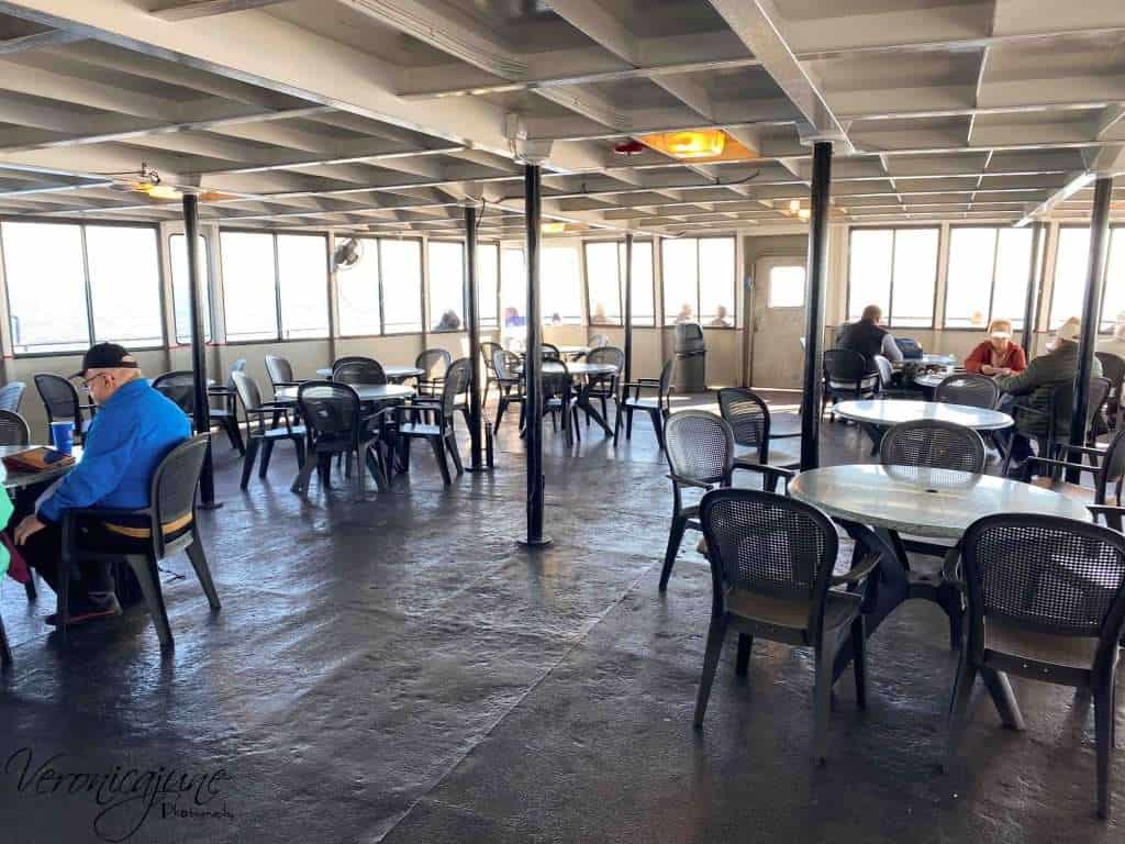 an open area with tables. The Cabana Room on the SS Badger