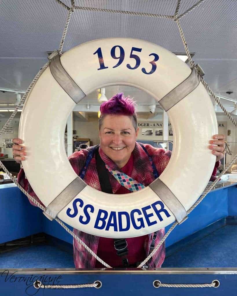 The author poses in the middle of a life ring with the words 1953 and SS Badger printed on it