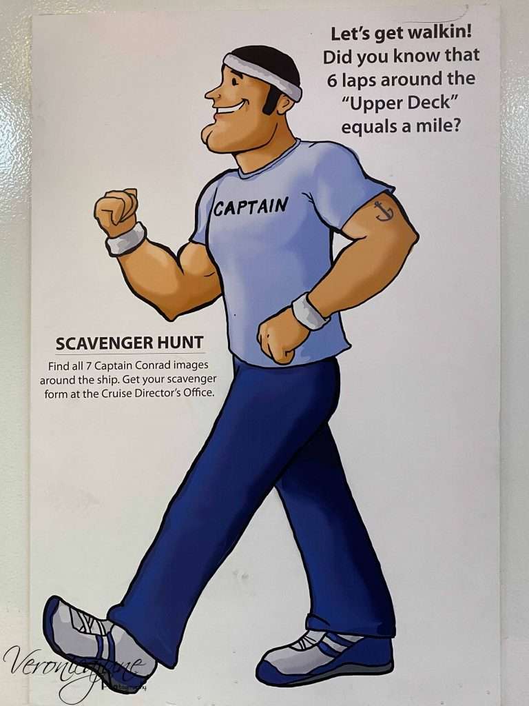 a sign on the wall shows a cartoon man walking with the words stating that 6 trips around the deck equals 1 mile