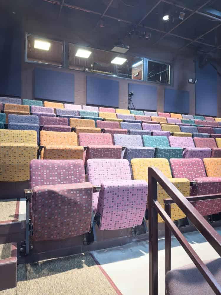 Colorful theater seats in an auditorium, perfect for entertainment and events.