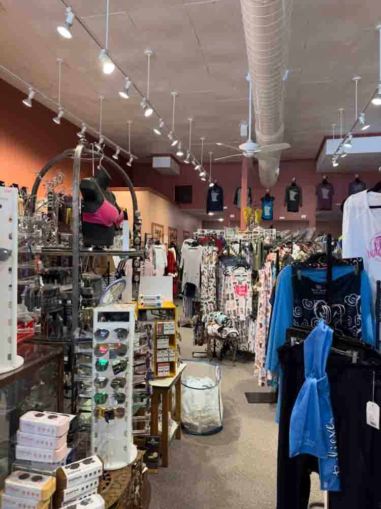 Vibrant boutique clothing store filled with casual and trendy women's apparel, accessories, and sunglasses, perfect for stylish grandma fashion and comfortable op outfits.
