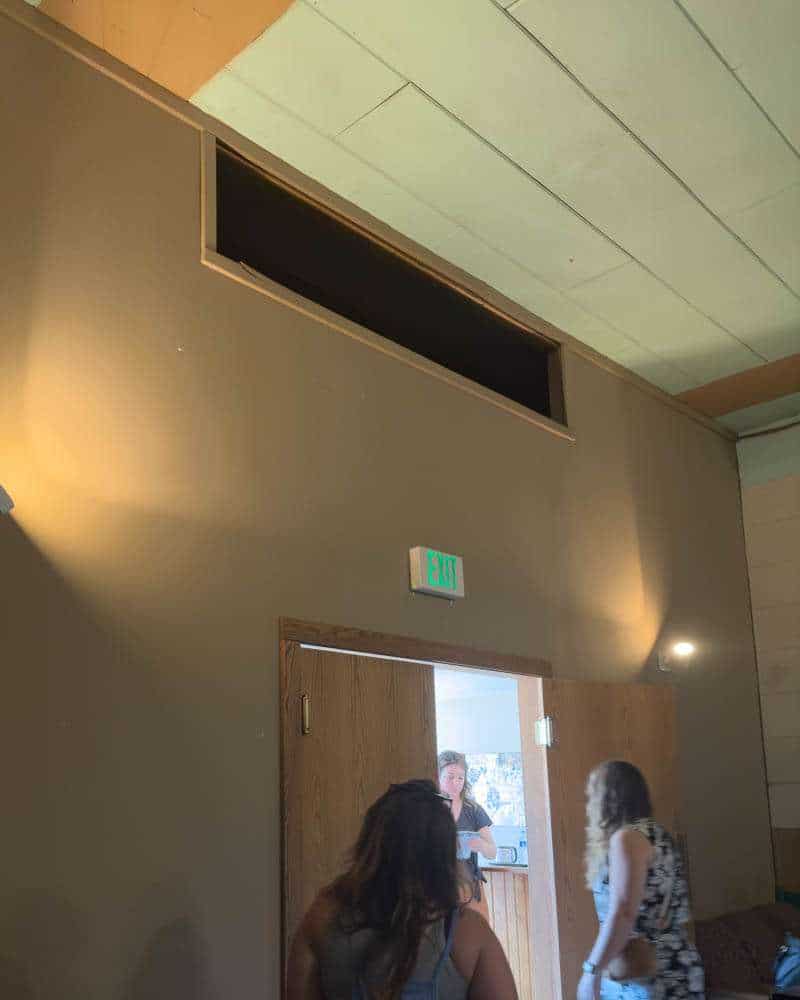 The window high on the wall in the rear of the St. Mane Theater
