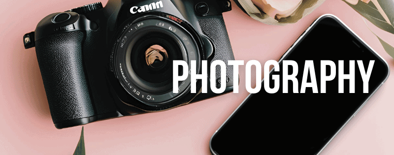 Canon DSLR camera with lens and smartphone on a pink background, representing photography tips for active and stylish grandmothers.