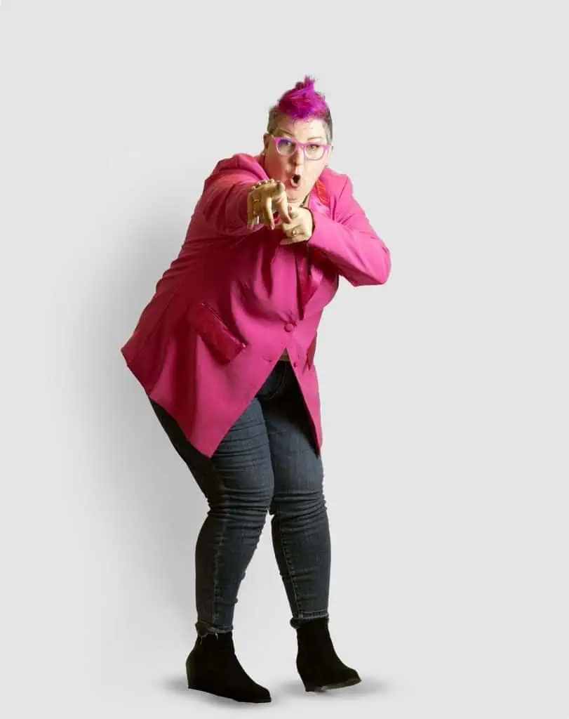 Full Body Shot of the Hip Grandma with pink hair and a pink blazer